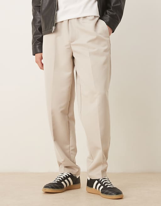 DESIGN tapered fit smart trousers with elasticated waistband in stone