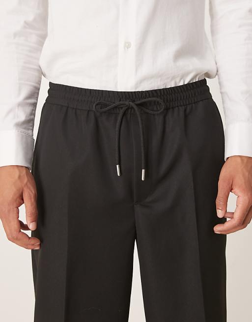 DESIGN Tapered Fit Trouser With Elasticated Waist And Cuffs In Black