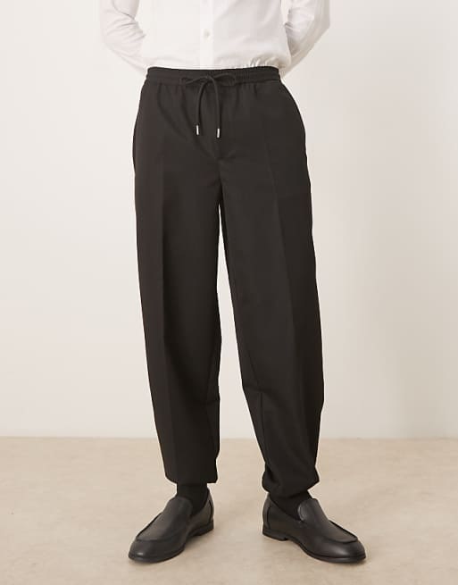 DESIGN tapered fit trouser with elasticated waist and cuffs in black