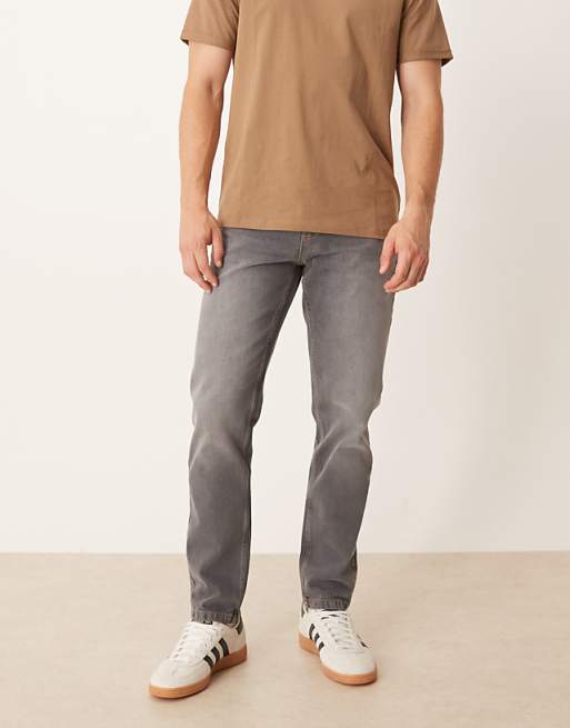 DESIGN tapered jeans in black wash