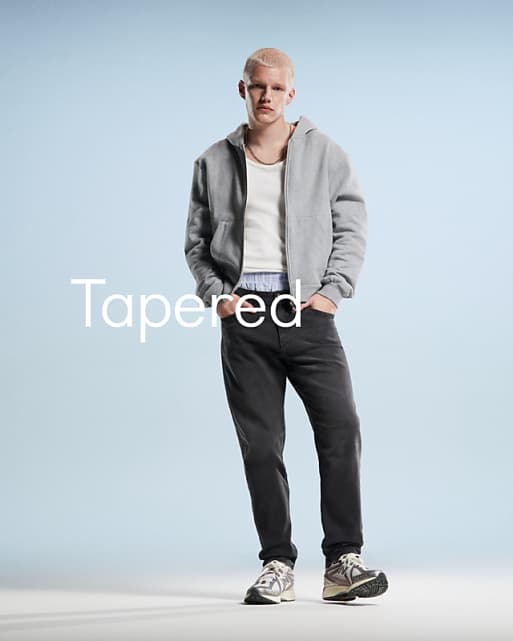 DESIGN tapered jeans in black wash