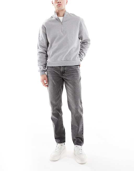 DESIGN tapered jeans in washed grey