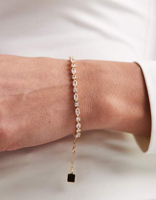 DESIGN tennis bracelet with cubic zirconia stone details in gold tone in gift bag