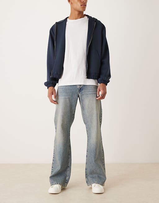 DESIGN wide flare jeans in light wash blue with tint