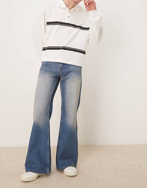 DESIGN wide flare jeans in tinted wash