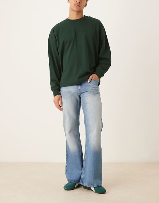 DESIGN wide flare jeans in vintage wash