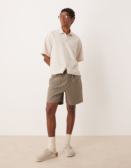 DESIGN wide mid length pleated shorts with drawstring in khaki