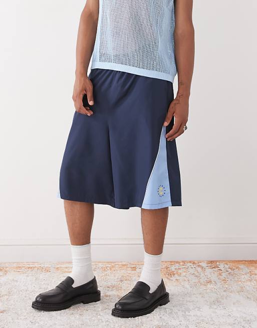 COLLUSION Panelled football style shorts in blue
