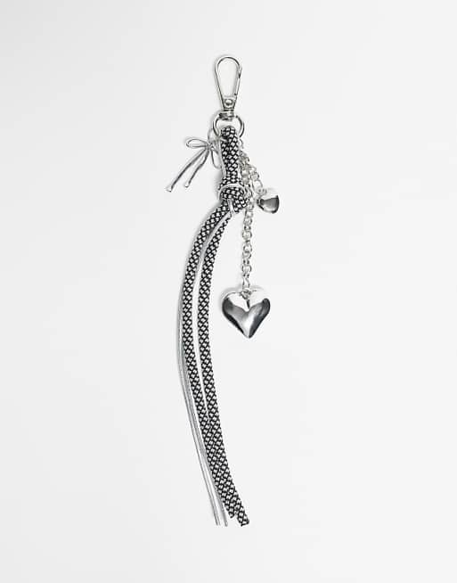 DesignB London bungee cord and heart bag charm in black and white polka dot