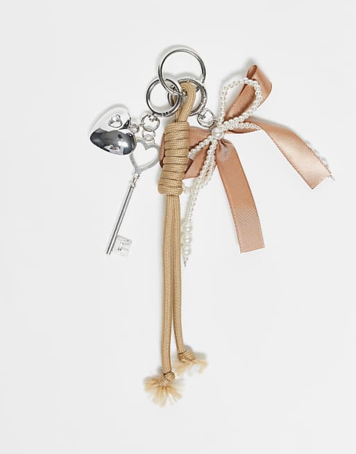 DesignB London bungee cord and pearl bow bag charm in brown