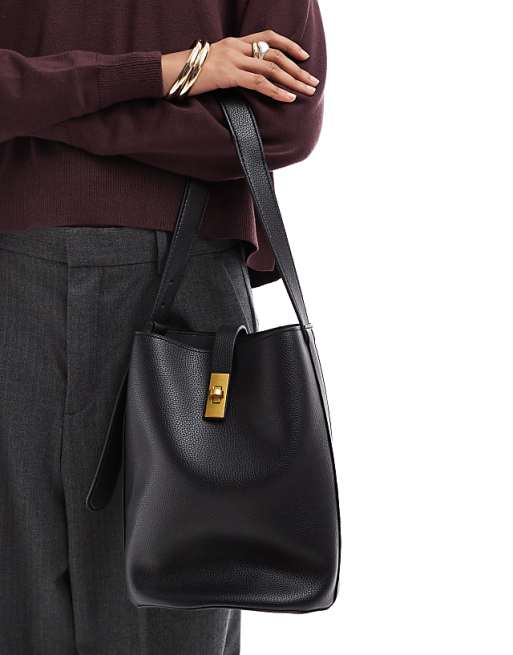 Glamorous bucket bag with gold detail in black