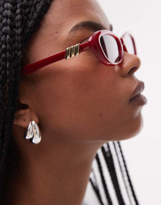 Le Specs The Whisperer Oval Sunglasses In Garnet Red