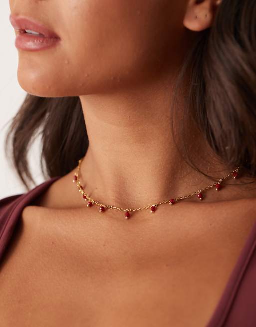 Lost Souls red stone charm necklace in 18ct gold plated stainless steel