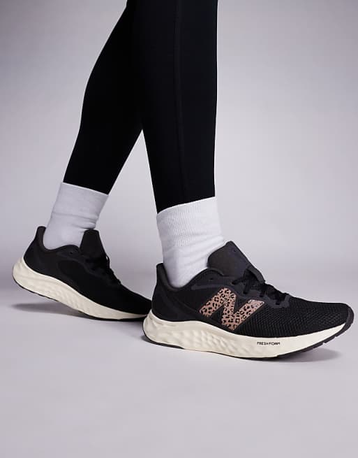 New Balance Arishi running trainers in black and leopard