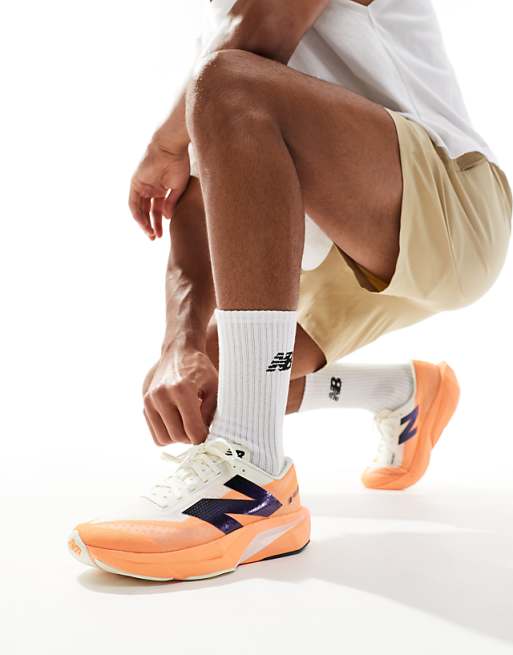 New Balance Fuelcell Rebel V4 mens running trainers in orange