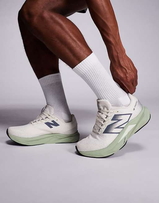 New Balance Propel running trainers in beige and green