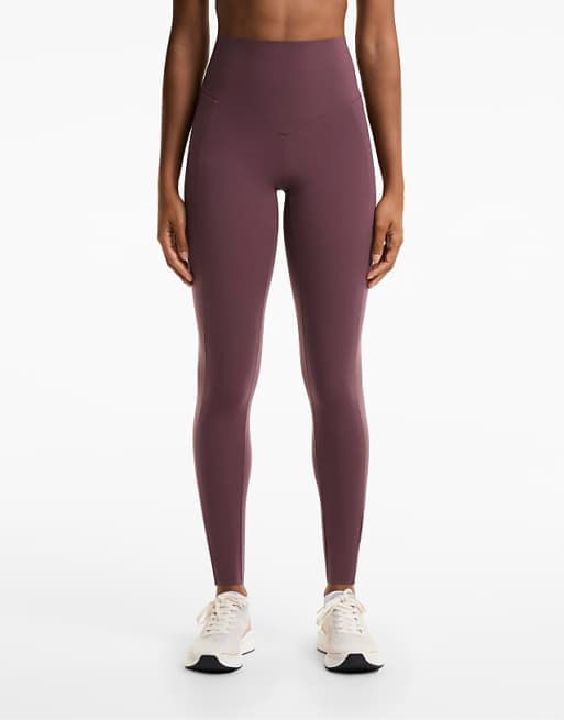 OYSHO Compressive pocket high-rise 65cm ankle-length leggings in burgundy