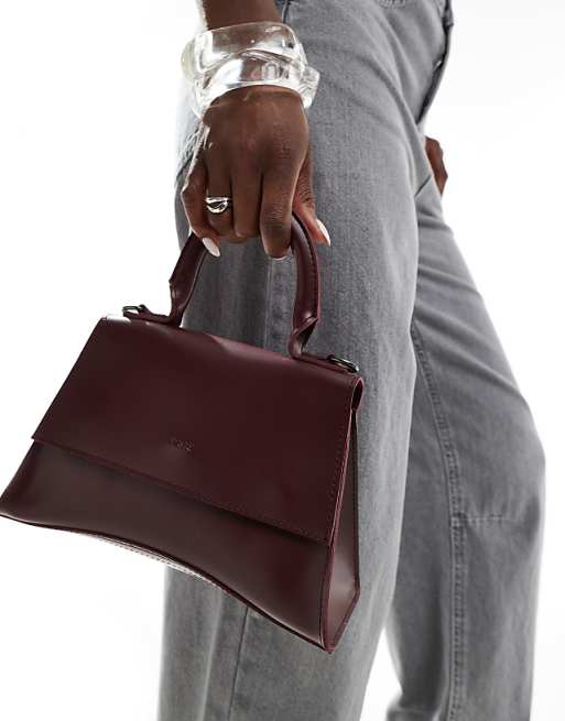 PASQ Mini Curved Bottom Grab Bag With Cross Body Strap In Burgundy