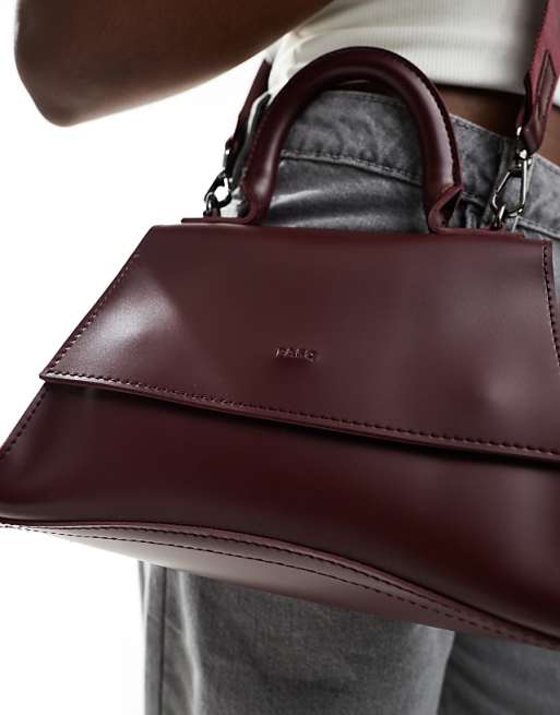 PASQ Mini Curved Bottom Grab Bag With Cross Body Strap In Burgundy