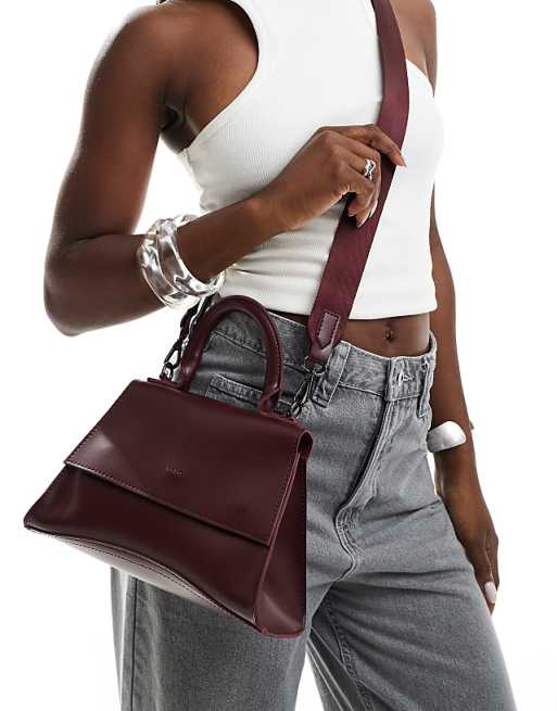 PASQ mini curved bottom grab bag with cross body strap in burgundy