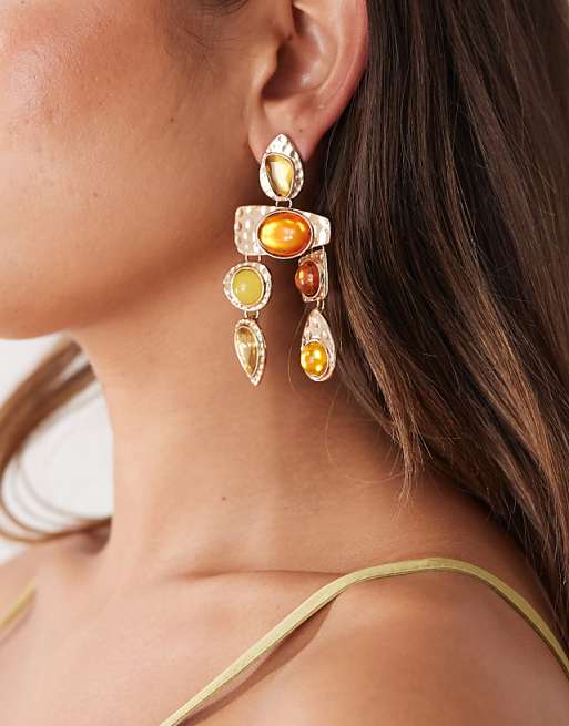 Petit Moments statement earrings in gold and burngundy stone