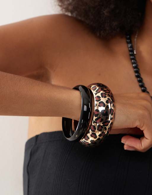 Reclaimed Vintage festival bangle 2 pack in black and gold leopard print
