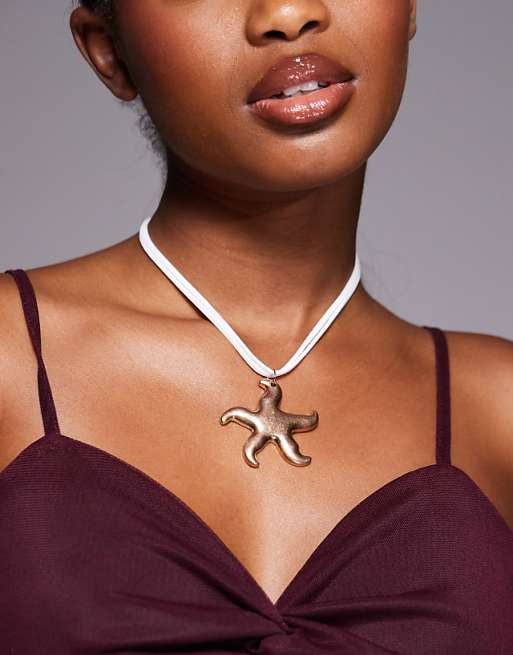 South Beach starfish pendant cord necklace in gold
