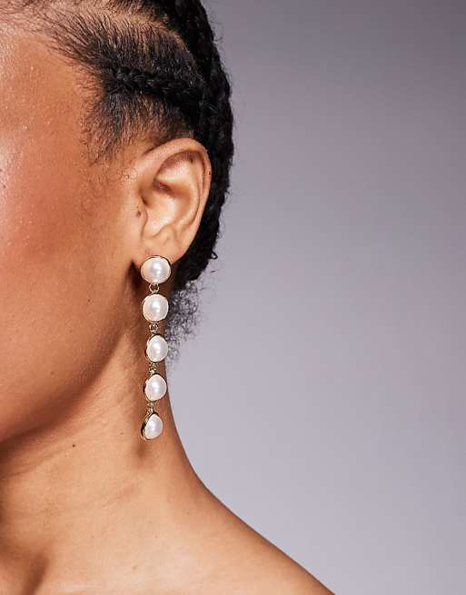 True Decadence pearl drop earrings in gold