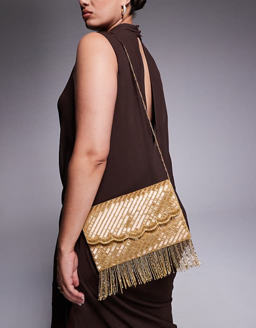 True Decadence tassle embellished envelope clutch bag in gold