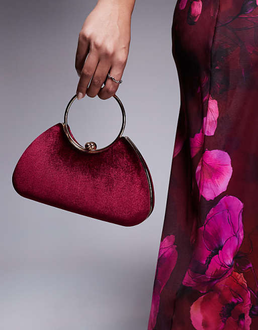 True Decadence velvet clutch bag with detachable crossbody strap in burgundy and gold