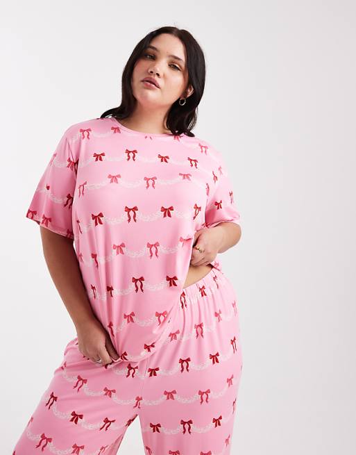 Urban Threads Curve Christmas short sleeve revere and trouser pyjama set in festive bow print